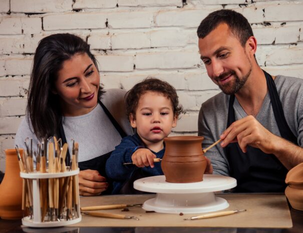 young-happy-caucasian-family-with-son-working-on-p-2023-11-27-04-49-06-utc