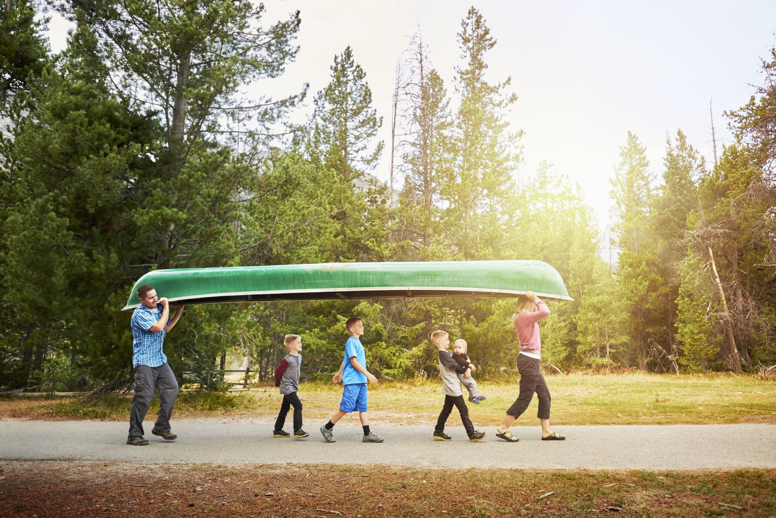 family-with-four-children-carrying-canoe-grand-te-2023-11-27-05-18-50-utc (1)